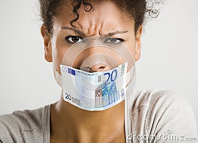 Covering mouth with a euro banknote Stock Photo