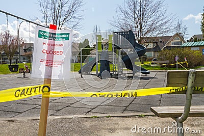 COVID closed Playground sign and park bench Stock Photo