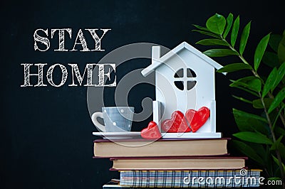 COVID-19 Coronavirus STAY HOME social media message, COVID-19 staying at home concept. Cute home interior, hearts in the house, Stock Photo