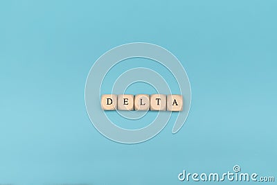 Covid-19 delta word on wooden cubes. Covid-19 delta word withon blue background. Sars covid-19 delta strain Stock Photo