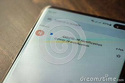 Covid 19 email notification on smartphone screen in england UK Stock Photo
