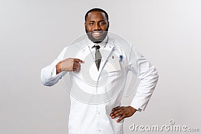 Covid19, healthcare and clinic concept. Portrait of confident handsome african-american doctor, pointing himself and Stock Photo