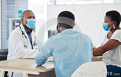 Covid, healthcare and doctor consulting a black couple in a hospital for wellness, insurance or treatment. Medical Stock Photo