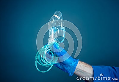 COVID-19 High Demand and shortage of ventilators in hospitals. Exhausted Doctor holding ventilator Stock Photo
