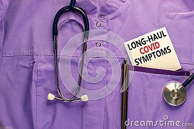 COVID-19 long-haul covid symptoms symbol. White card with words Long-haul covid symptoms. Medical uniform, metalic pen and Stock Photo
