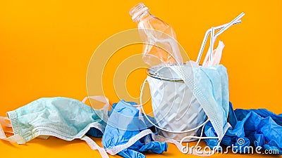 COVID-19 Medical Waste. Disposal of gloves, masks, empty plastic bottles of sanitizer. Used personal protective equipment PPE . Stock Photo