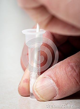 Covid nasal swab inserter in test vial Stock Photo