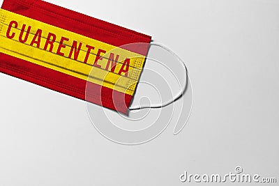 COVID-19, Quarantine. surgical mask with the Spain flag showing the message Stock Photo