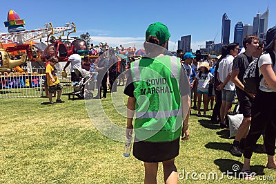 COVID Safety Marshall patrolling in a park during Australia Day Editorial Stock Photo