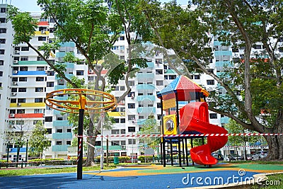 COVID19 tape barriers surrounding playground in Singapore Editorial Stock Photo