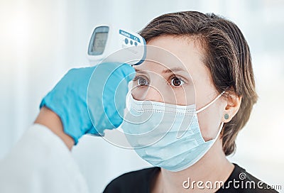 Covid, thermometer and doctor scan fever temperature of woman with mask consulting in hospital. Female patient test for Stock Photo