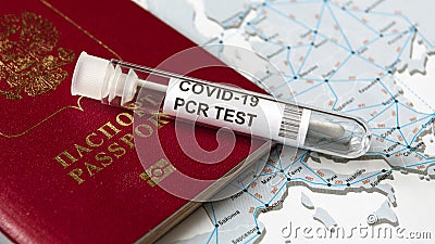 COVID-19, travel and test concept, tube for coronavirus PCR testing and Russian tourist passport Stock Photo