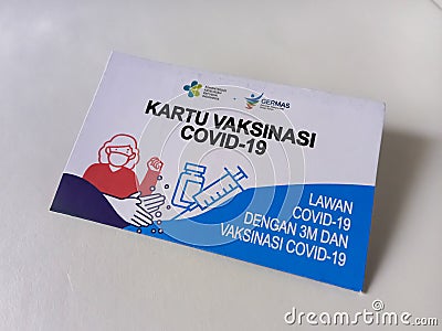 The COVID-19 vaccination card given by the Indonesian government to the vaccine recipient community. Editorial Stock Photo