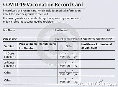 Covid 19 vaccination record card in both English and Spanish languages. Individual record for use during the covid 19 coronavirus Stock Photo