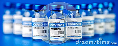 Covid-19 vaccine - coronavirus vaccination bottles. injection vials on blue background Stock Photo