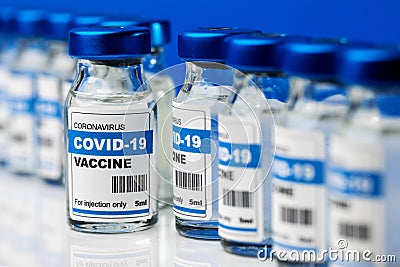 Covid-19 vaccine - coronavirus vaccination bottles in a line. injection vials Stock Photo