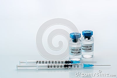 COVID-19 vaccine Vials with syringes Stock Photo