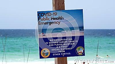 COVID-19 Warning Sign on the beach Editorial Stock Photo