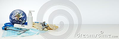 World globe, stethoscope, medical masks, sanitizer, thermometer. Quarantine. Coronavirus. Covid. Extra wide banner background Stock Photo