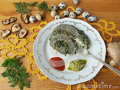 Cow parsley omelet on plate, Cooking with ginger, wild plants, Cow parsley and goutweed Stock Photo