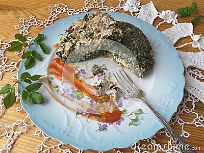 Cow parsley omelet on plate, Cooking with ginger, wild plants, goutweed Stock Photo