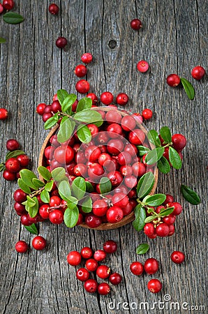 Cowberry in wooden bowl Stock Photo