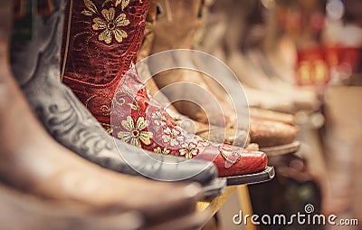 Cowboy boots in a store, vintage style shoes Stock Photo