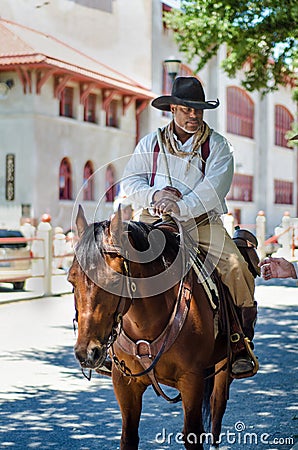 Cowboy on a brown horse Editorial Stock Photo