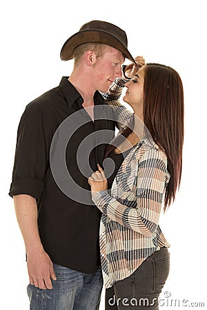 Cowboy couple faces close touch hat Stock Photo