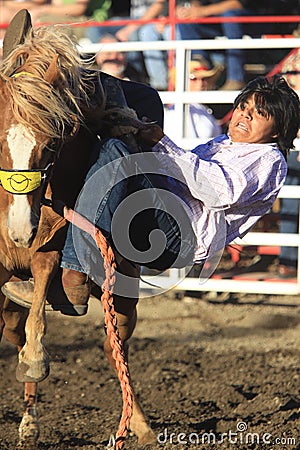 Cowboy getting bucked Editorial Stock Photo