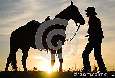 Cowboy with his horse Stock Photo