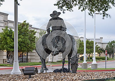 Cowboy on a horse, part of the longest bronze sculpture collection in the United States in The Center at Preston Ridge. Editorial Stock Photo