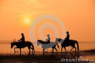 Cowboy and horse with sunset Stock Photo