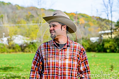 Cowboy Rancher Looking to side and smiling Stock Photo