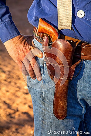 Cowboy with Revolver in Holster Stock Photo