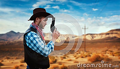 Cowboy with revolver, gunfight in gesert valley Stock Photo