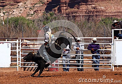 Cowboy riding a bull Editorial Stock Photo