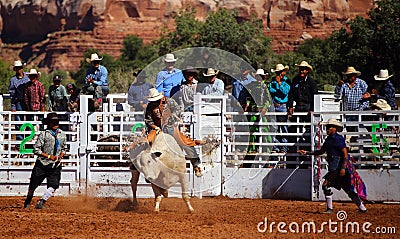 Cowboy riding a bull Editorial Stock Photo