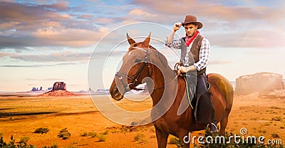 Cowboy riding a horse in desert valley, western Stock Photo