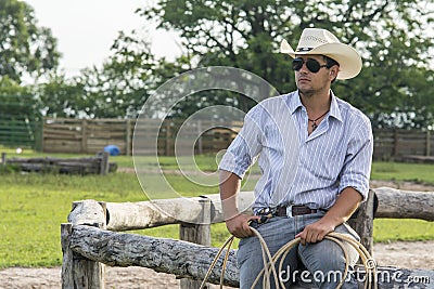 Cowboy seated Stock Photo