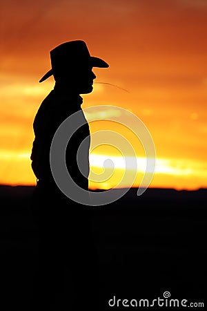 Cowboy Watching the Sunset Stock Photo