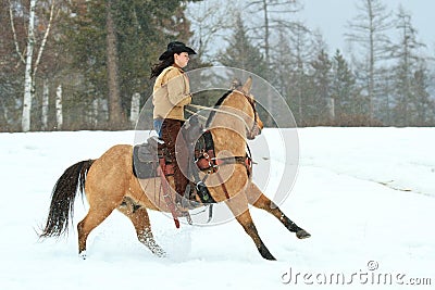 Cowgirl pulling back on the reins Editorial Stock Photo