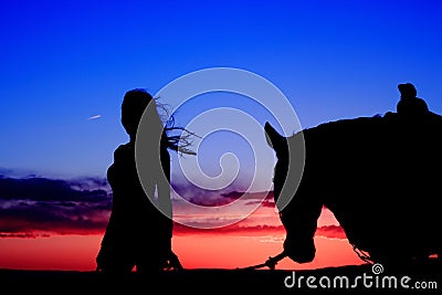 Cowgirl Sunset Stock Photo