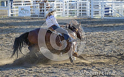 Cowgirls competing in barrel riding Editorial Stock Photo