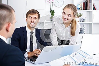 Coworkers chatting about business project Stock Photo