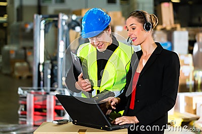 Coworkers at warehouse of forwarding company Stock Photo