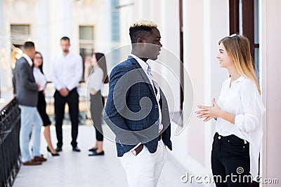 Coworking team meeting. Group of two businessmans working with new startup project in front of team in modern office Stock Photo