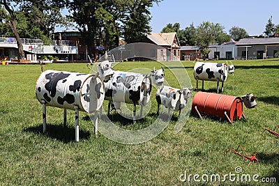 Cows craft made of metal barrels in a garden in Erqi factory 1897 science and technology innovation Editorial Stock Photo