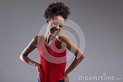 Coyly giggling woman in red shirt Stock Photo