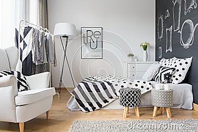 Cozy bedroom with blackboard wall Stock Photo